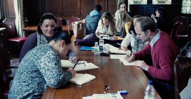 Students writing up notes during lectures